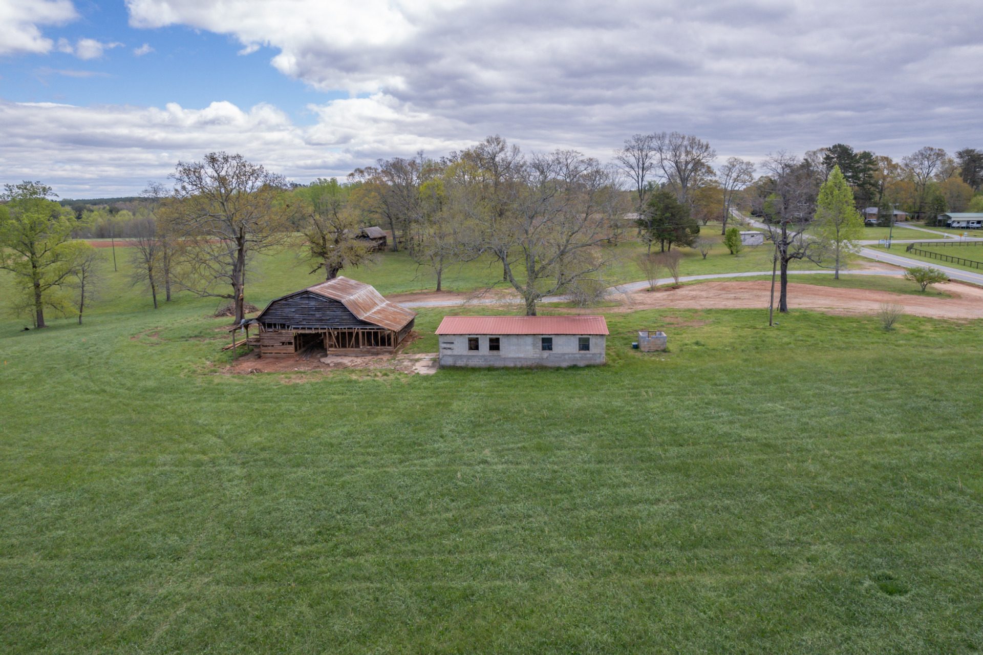 5.95 acres with two barns close to trails